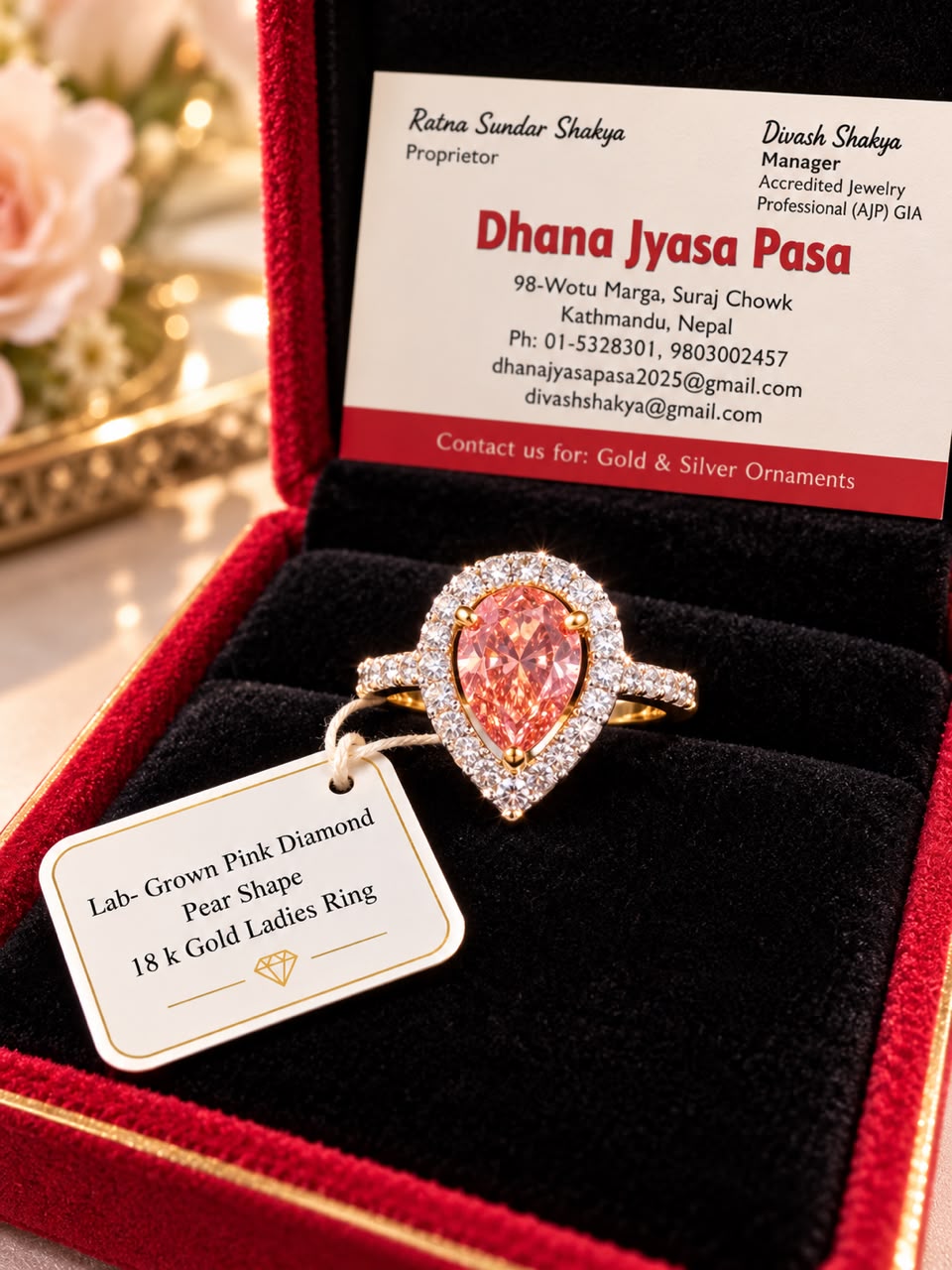 18K gold ladies ring with a pear-shaped lab-grown pink diamond, in a red box