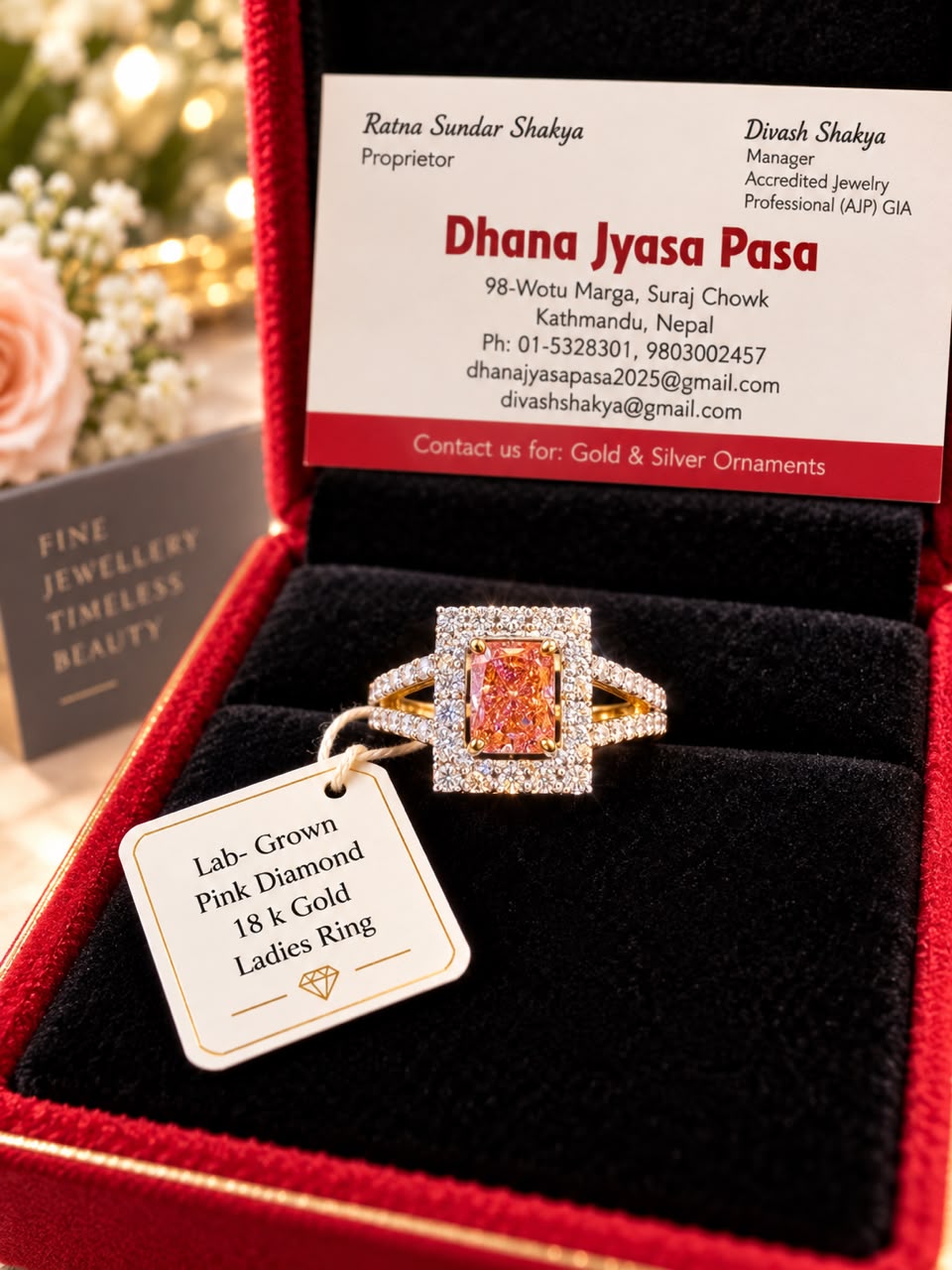18K gold ladies ring with a rectangular lab-grown pink diamond, in a red box