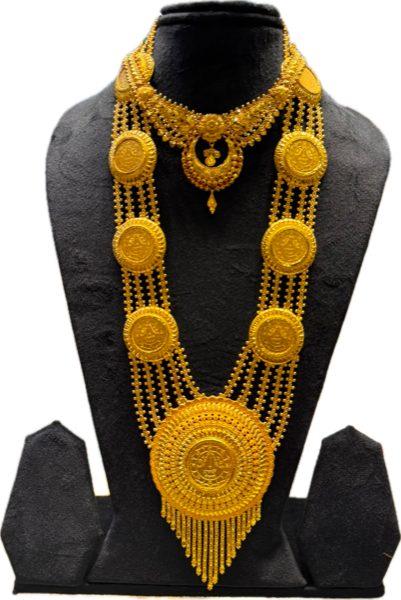 Multi-strand gold necklace with coin-like medallions, a large round pendant and a gold fringe
